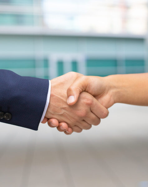 Closeup shot of business handshake. Cropped shot of two people wearing formal suits shaking hands. Business handshake concept